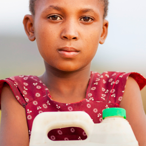 Young kid holding a bottle of water