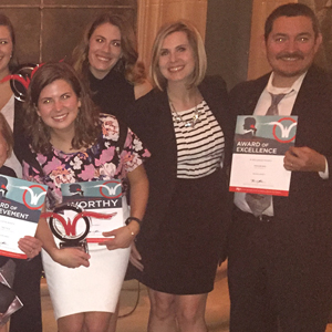 Balcom employees holding the Worthy Award